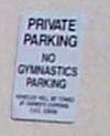 "PRIVATE PARKING NO GYMNASTICS PARKING" sign