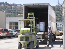 Peterson Products factory worker receiving delivery