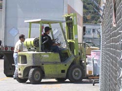 Peterson Products factory worker driving in delivery into factory from Karen Road